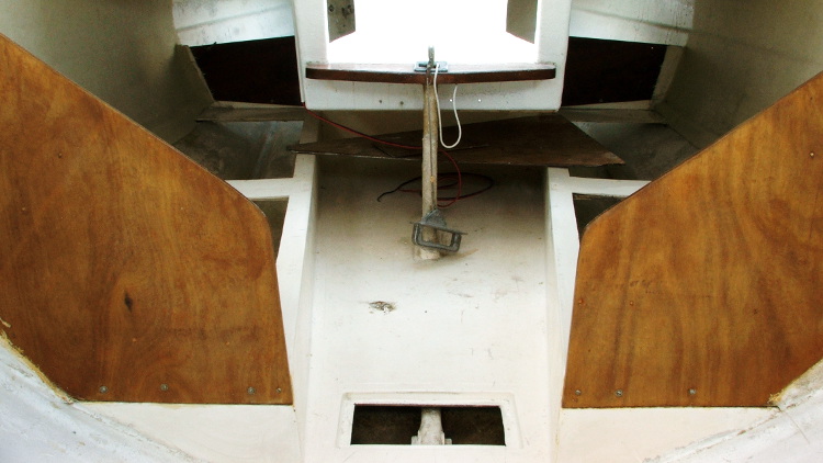 The cabin moulding, showing the quarter-berth supports and keel housing joining the companionway step