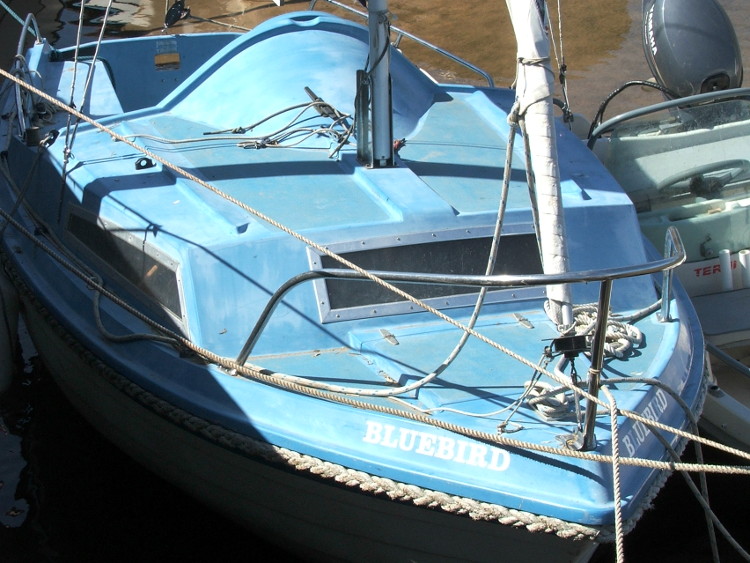 Bluebird against the harbour wall at Blakeney